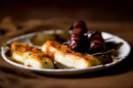 Photo for Baked halloumi cheese served with toasts. - Royalty Free Image