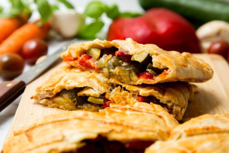 Photo for Galician empanada stuffed with vegetables. Typical recipe from northern Spain. - Royalty Free Image