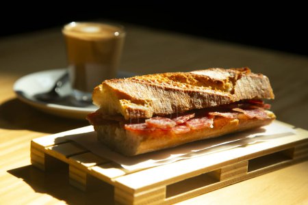 Photo for Fuet sandwich in a Spanish restaurant at breakfast time. - Royalty Free Image