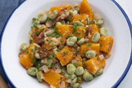 Photo for Sauted pumpkin with broad beans. Traditional Spanish recipe. - Royalty Free Image