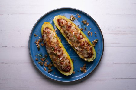 Photo for Zucchini stuffed with meat and baked in the oven. Traditional Spanish tapa recipe. - Royalty Free Image