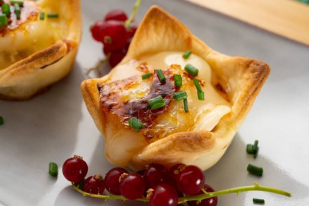 Photo for Goat cheese appetizers on shortcrust pastry. - Royalty Free Image