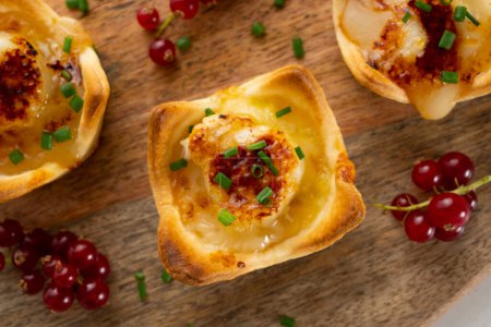 Photo for Goat cheese appetizers on shortcrust pastry. - Royalty Free Image