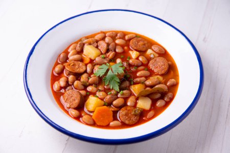 Photo for White bean stew with chorizo. Traditional Spanish recipe from north Spain called fabada asturiana. - Royalty Free Image