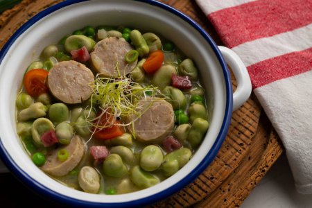 Photo for Bean stew with ham and pork sausage. Traditional Spanish tapa recipe. - Royalty Free Image