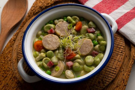 Photo for Bean stew with ham and pork sausage. Traditional Spanish tapa recipe. - Royalty Free Image