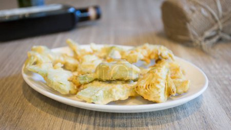 Photo for Dish with battered artichokes. Traditional Spanish tapa. - Royalty Free Image