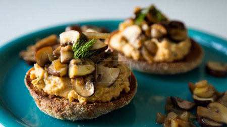 Photo for Toast with hummus and sauted mushrooms. vegan recipe. - Royalty Free Image