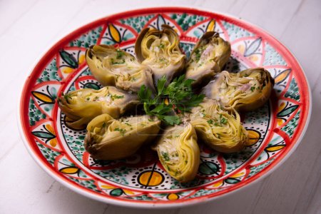 Photo for Baked artichokes with salt. Traditional Spanish recipe. - Royalty Free Image