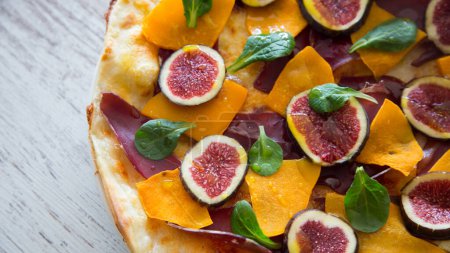 Photo for Neapolitan pizza with pumpkin and fresh figs. - Royalty Free Image