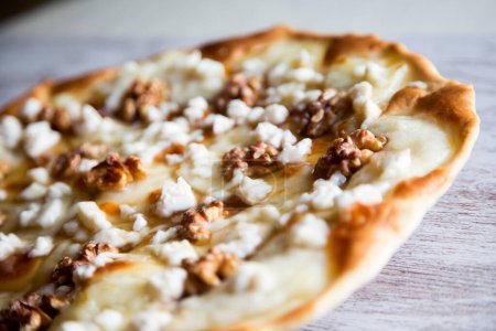Photo for Sweet pizza with fresh cheese, nuts and honey. Neapolitan pizza made with Italian Recipe. - Royalty Free Image
