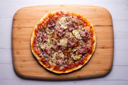 Photo for Bacon pizza with mushrooms. Neapolitan pizza with mozzarella cheese and bacon. Authentic Italian recipe. - Royalty Free Image