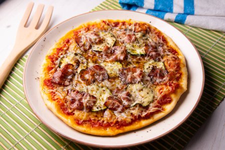 Photo for Bacon pizza with mushrooms. Neapolitan pizza with mozzarella cheese and bacon. Authentic Italian recipe. - Royalty Free Image