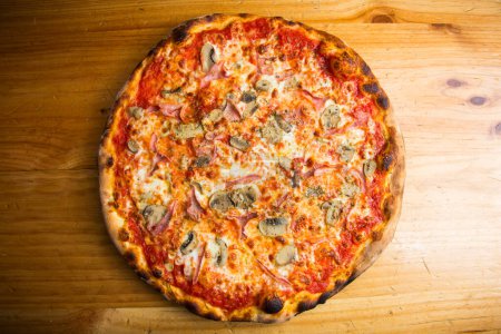 Photo for Mushroom Pizza. Neapolitan pizza with tomato sauce, cheese, ham and mushrooms. Authentic Italian recipe. - Royalty Free Image
