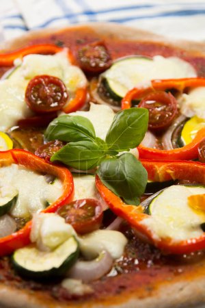 Photo for Pizza with vegetables. Neapolitan pizza made with baked vegetables. Italian vegetarian recipe. - Royalty Free Image