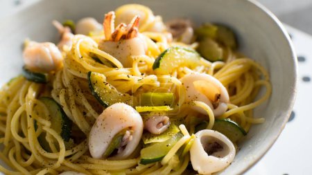 Photo for Frutti di mare pasta recipe. Pasta combined with mussels, clams and prawns, fried tomato and garlic - Royalty Free Image