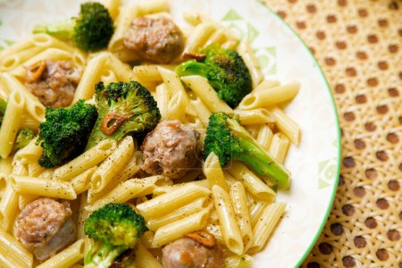 Photo for Macaroni with sausage and broccoli recipe. Traditional Italian recipe. - Royalty Free Image