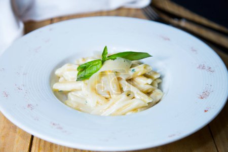 Photo for Italian pasta with cheese sauce in an Italian restaurant. - Royalty Free Image