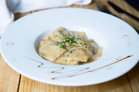 Photo for Ravioli or Raviol is the name of a type of Italian stuffed pasta made with different ingredients and generally folded into a square shape. They are accompanied by some type of sauce, especially tomato, tucos, pesto or cream - Royalty Free Image