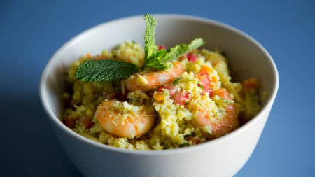 Photo for Fake cauliflower risotto with prawns and vegetables. - Royalty Free Image