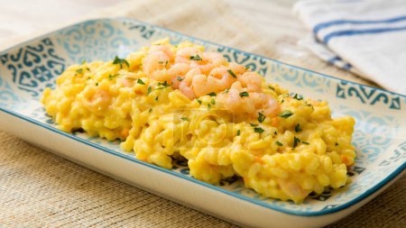 Photo for Italian curry risotto recipe with prawns. - Royalty Free Image