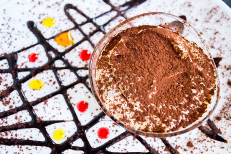 Photo for Tiramisu is a cold cake that is assembled in layers. Coffee, chocolate powder, and mascarpone are the main ingredients of this Italian dessert. - Royalty Free Image