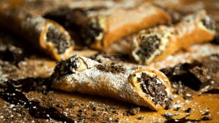 The cannolo is a typical sweet from the Italian region of Sicily, where it originates from. It consists of a rolled dough in the shape of a tube that contains ingredients mixed with ricotta cheese inside.