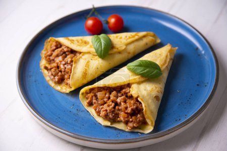 Photo for Crepes bolognese. It is called  crepe,  crepe,  crep or creps to the European recipe of Spain/Spanish origin made mainly of wheat flour, with which a disk-shaped dough is made - Royalty Free Image