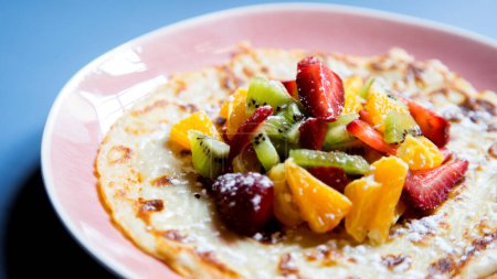 Photo for Crepes with fresh fruit. It is called  crepe,  crepe,  crep or creps to the European recipe of Spain/Spanish origin made mainly of wheat flour, with which a disk-shaped dough is made - Royalty Free Image