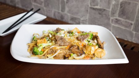 Photo for Beef dish with noodles in Asia. - Royalty Free Image