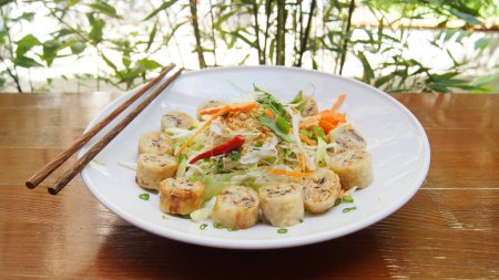 Photo for Vietnamese nem stuffed with vegetables. Ch gi, also known as nem rn, is a popular dish in Vietnamese cuisine that is usually served as an appetizer. - Royalty Free Image