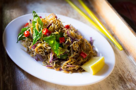 Photo for Fried fish salad and bean sprouts at a restaurant in Vietnam. - Royalty Free Image