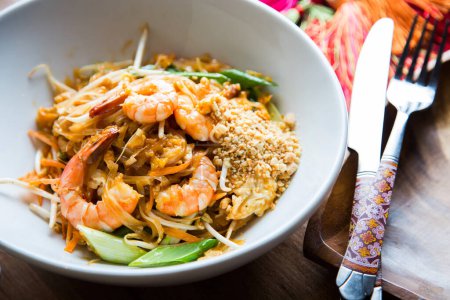 Photo for Pad thai, pad thai or pad thai, is a stir-fried rice noodle dish often served as street food in Thailand as part of the country's cuisine. - Royalty Free Image