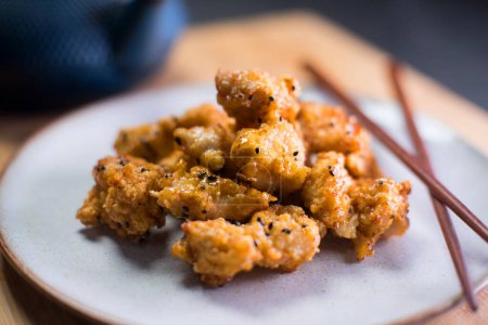 Photo for Karaage Chicken. Karaage is a Japanese culinary technique in which various ingredients commonly meat, and especially chicken are fried in oil. - Royalty Free Image