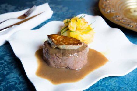 Photo for Top quality beef tenderloin with foie served with vegetables. - Royalty Free Image