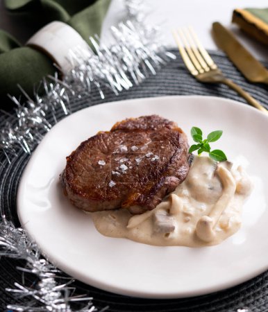 Photo for Top quality beef tenderloin served with mushrooms and cheese sauce. - Royalty Free Image
