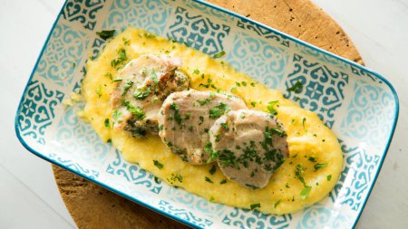Photo for Top quality pork tenderloin served smashed potatoes. - Royalty Free Image