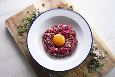 Photo for Steak tartare, steak tartare or beef tartare is a dish made from raw minced beef. - Royalty Free Image