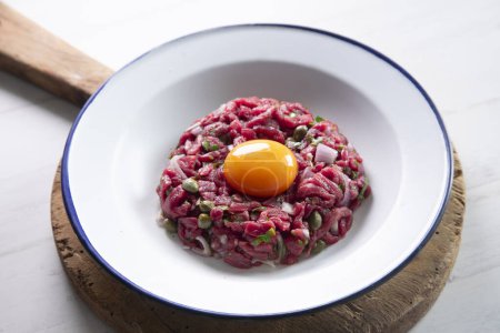 Photo for Steak tartare, steak tartare or beef tartare is a dish made from raw minced beef. - Royalty Free Image
