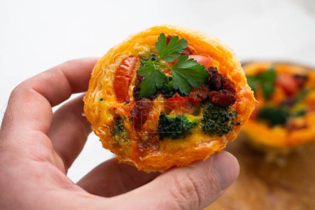 Photo for Puff pastry tartlets with Mallorcan sobrassada, broccoli and egg. - Royalty Free Image