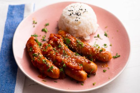 Photo for Pork sausages with tomato sauce and white rice. - Royalty Free Image
