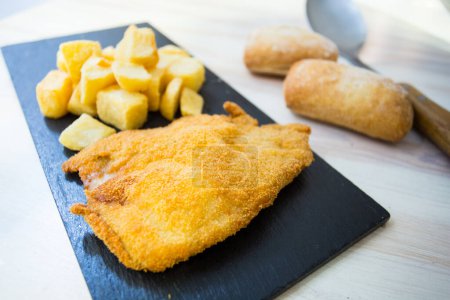 Photo for Breaded chicken fillet with French fries and salad. - Royalty Free Image