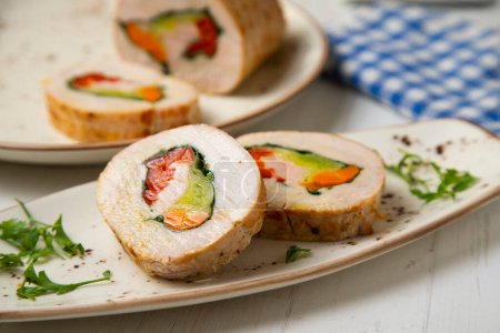 Photo for Baked turkey roll stuffed with carrots, spinach and red pepper. - Royalty Free Image