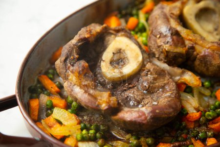 Photo for Baked beef ossobuco with vegetables. - Royalty Free Image