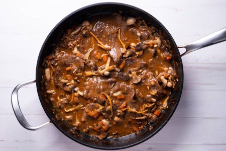 Photo for The fricando is a typical dish of Catalan cuisine, of ancient origin prepared with veal fillets and sauce with mushrooms. - Royalty Free Image