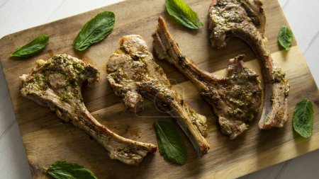 Photo for Top quality grilled lamb chops in a Spanish tapas restaurant. - Royalty Free Image