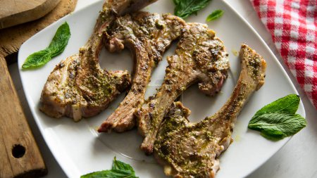 Photo for Top quality grilled lamb chops in a Spanish tapas restaurant. - Royalty Free Image