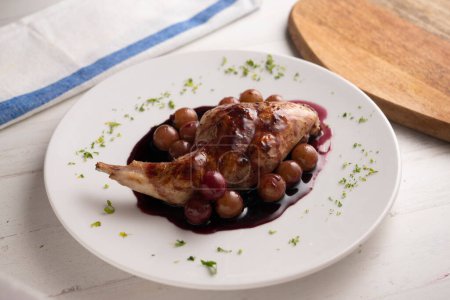 Photo for Wild rabbit cooked in a Spanish restaurant with wine sauce. - Royalty Free Image