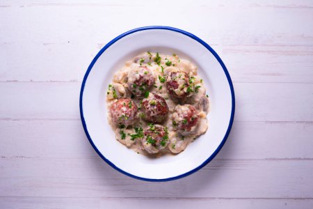 Photo for Handmade meatballs with pork and beef and yogur greek sauce. - Royalty Free Image
