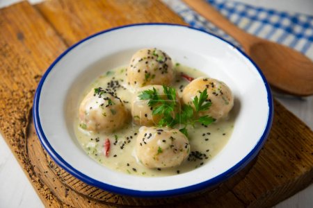 Photo for Fresh hake meatballs with white wine sauce. Traditional Spanish tapa recipe. - Royalty Free Image